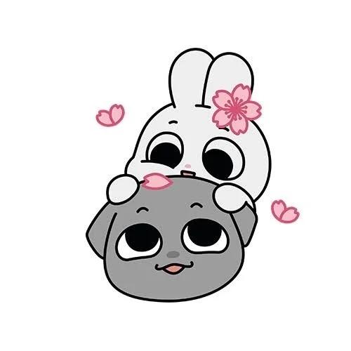 桜の花びらが舞う中、仲良しなウサギと犬のキャラクター